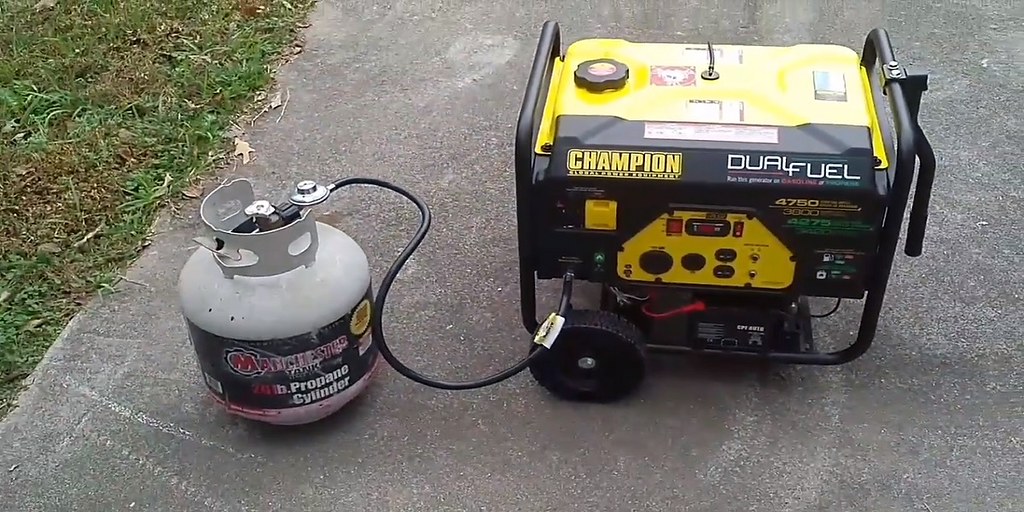 A portable inverter generator running on a driveway